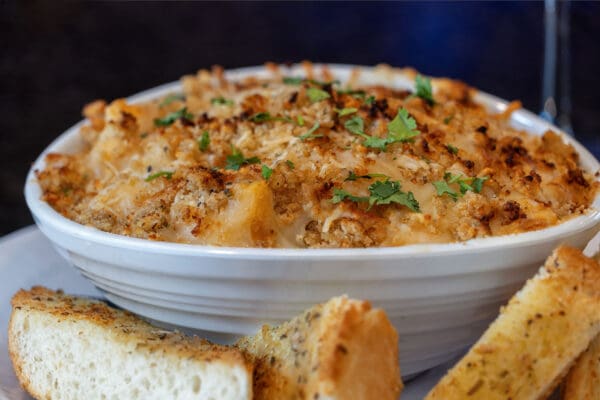 hearty bowl of soup with bread on the side