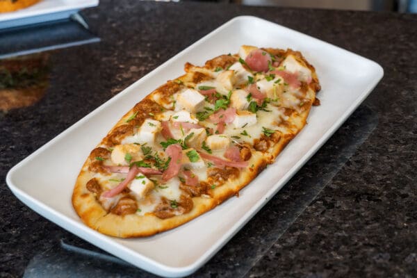 oblong pizza on a platter