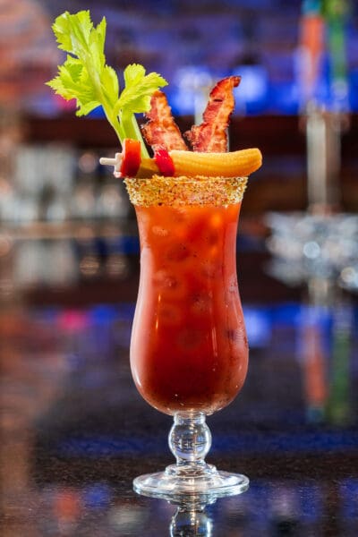 red drink with celery sticking out of it