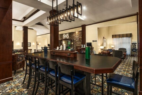 long table with several chairs pulled up to it